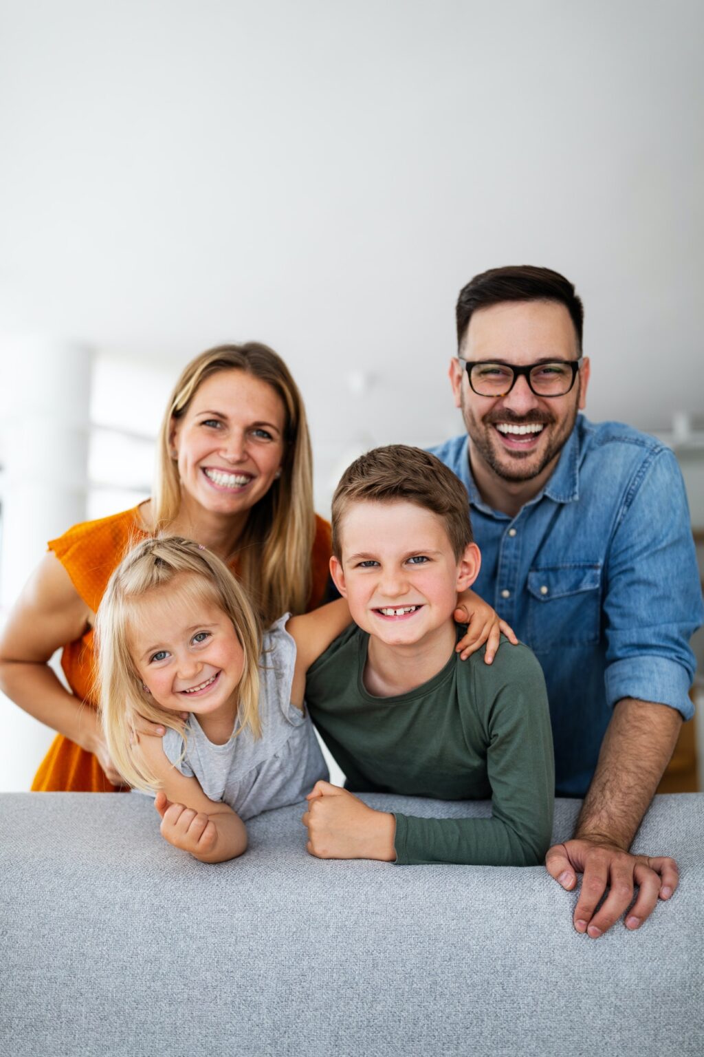 portrait-of-happy-smiling-family-at-home.jpg